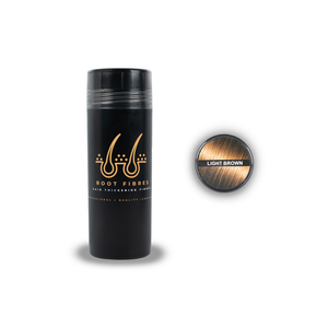 Front view of Root Fibres hair thickening fibres in a stylish black bottle with a prominent gold logo. The white and gold caption states 'Root Fibres Hair Thickening Fibres – Professional, Quality, Confident.' Additionally, the image includes a top view of the bottle with a Light Brown hair colour indicator featuring a picture of Light Brown hair and the caption 'Light Brown.' This product effectively conceals thinning hair, providing a natural and voluminous look.